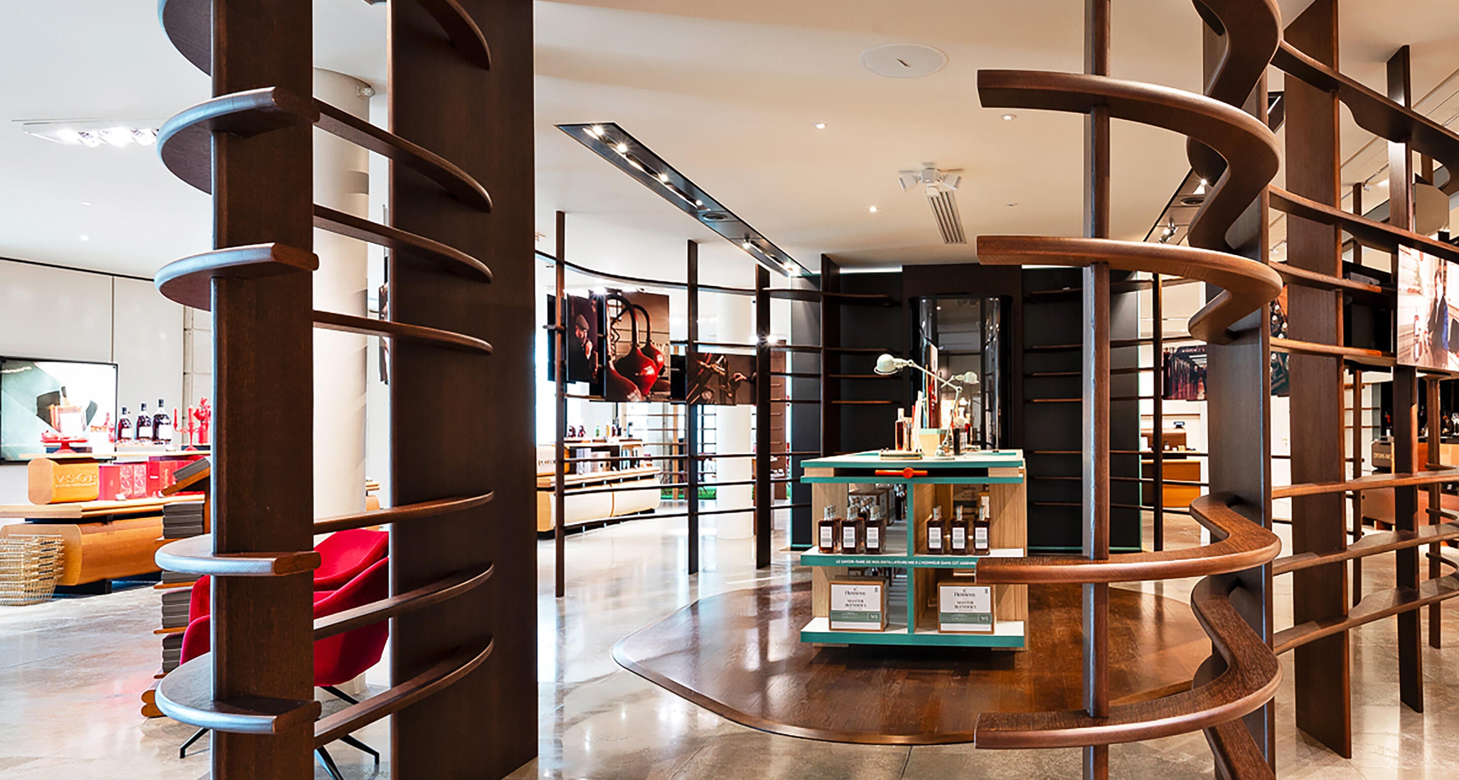 View of the Hennessy Cognac Boutique filled with natural light, showing colourful shelves
