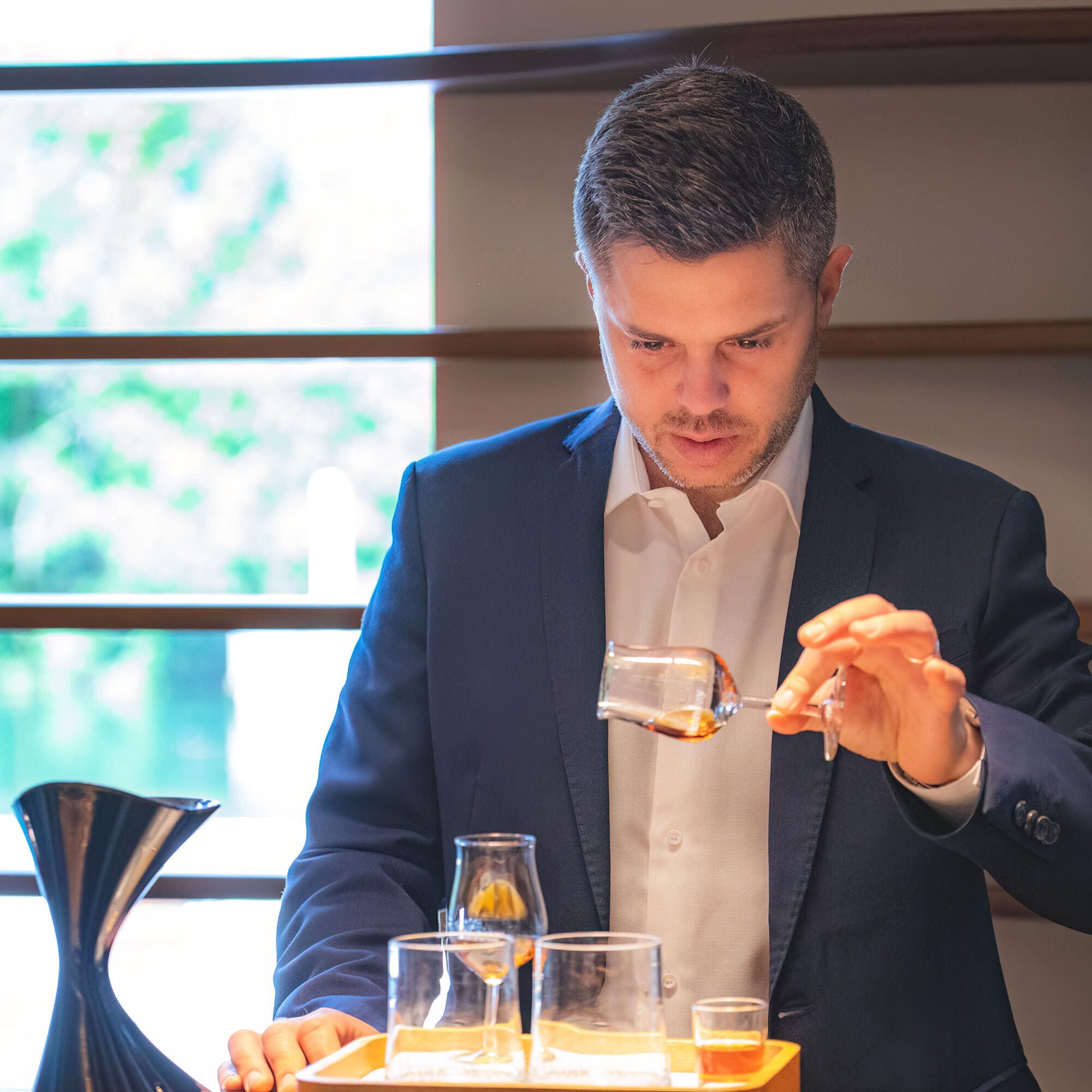 A professional Hennessy guide conducting a cognac tasting