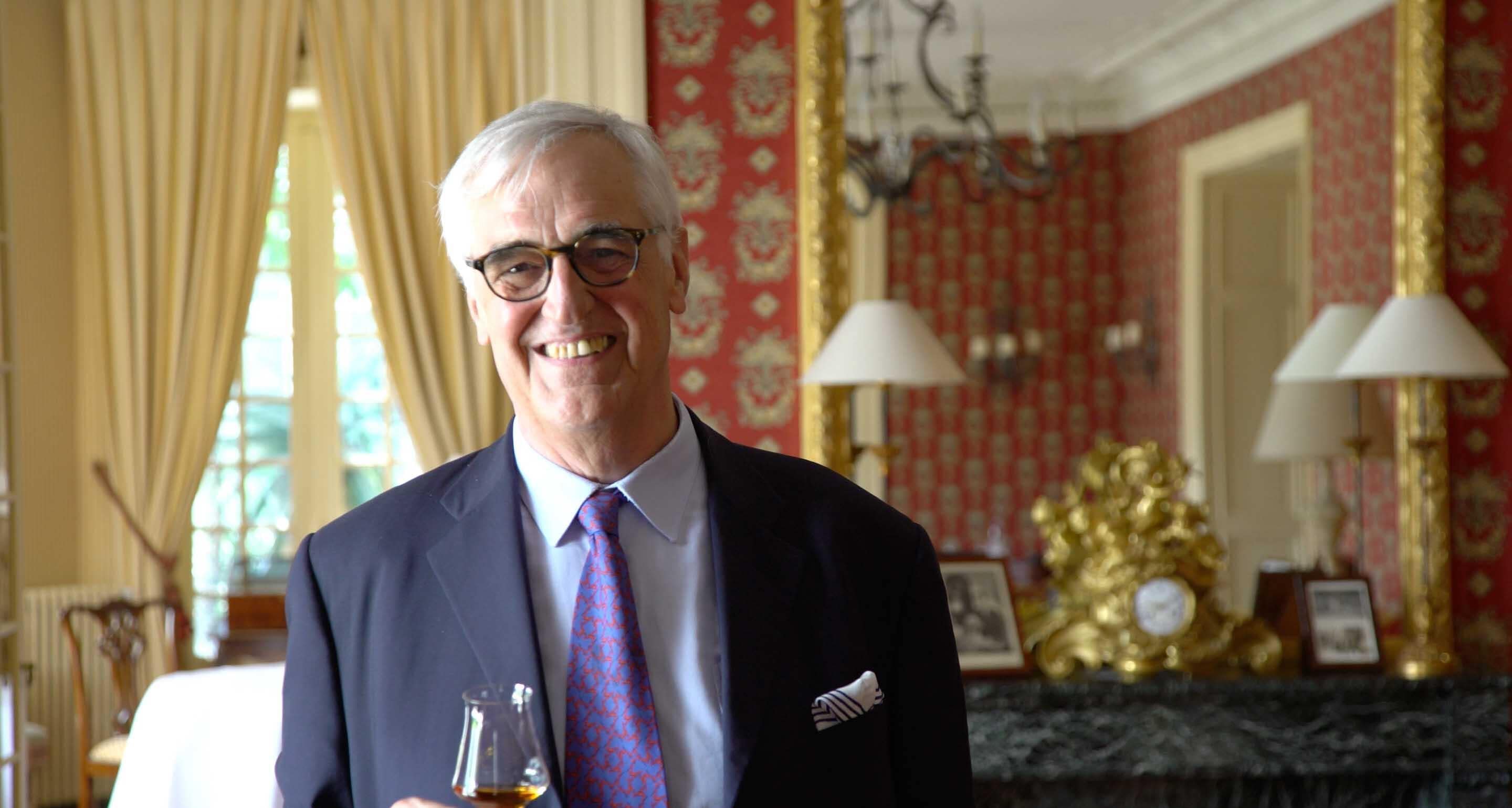 Maurice Hennessy, 8th generation member of the Hennessy Family, standing in the Chateau Hennessy, holding a glass of Hennessy Paradis Imperial.
