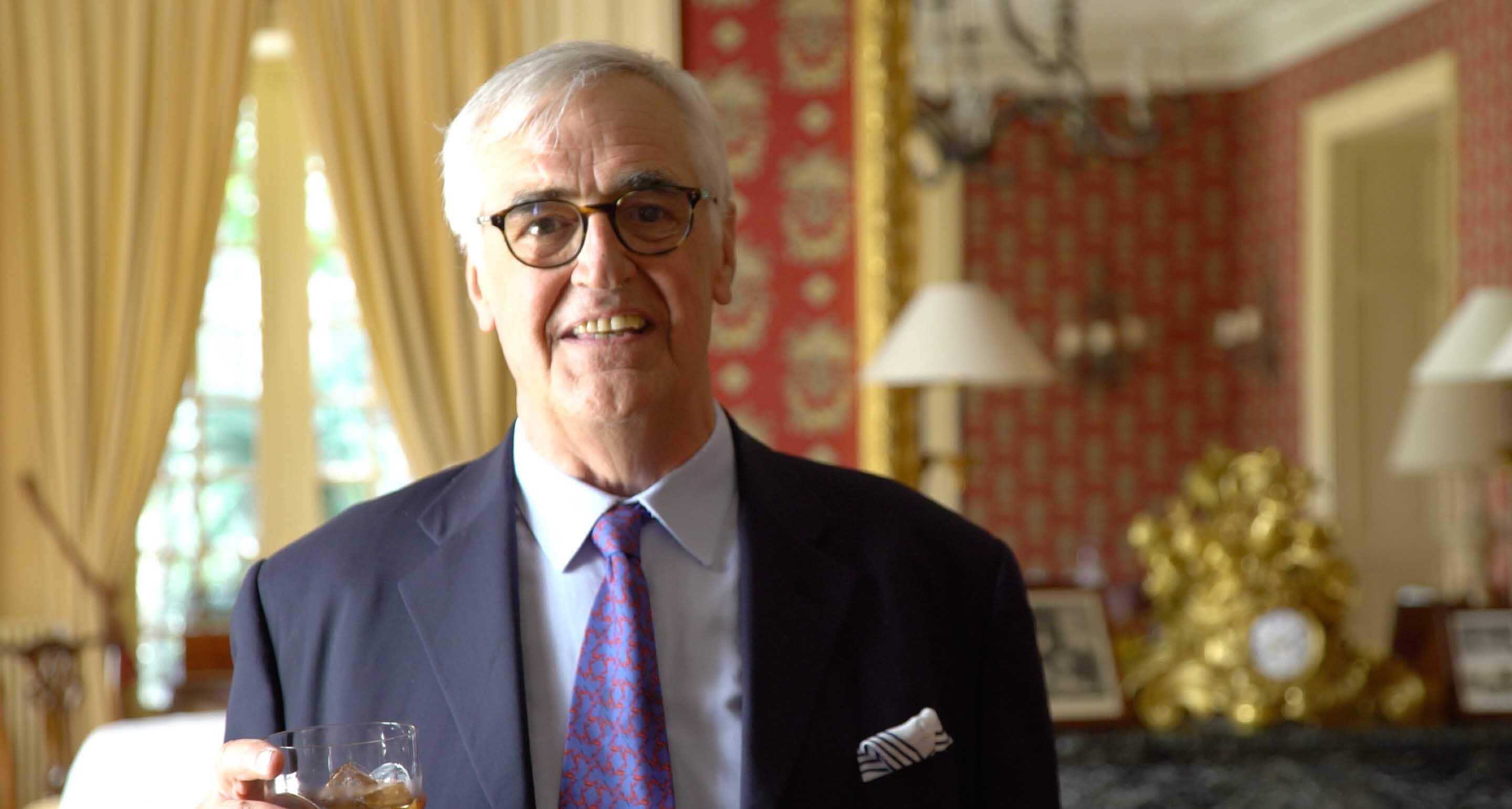 Maurice Hennessy, 8th generation member of the Hennessy Family, standing in the Chateau Hennessy, holding a glass of Hennessy X.O.