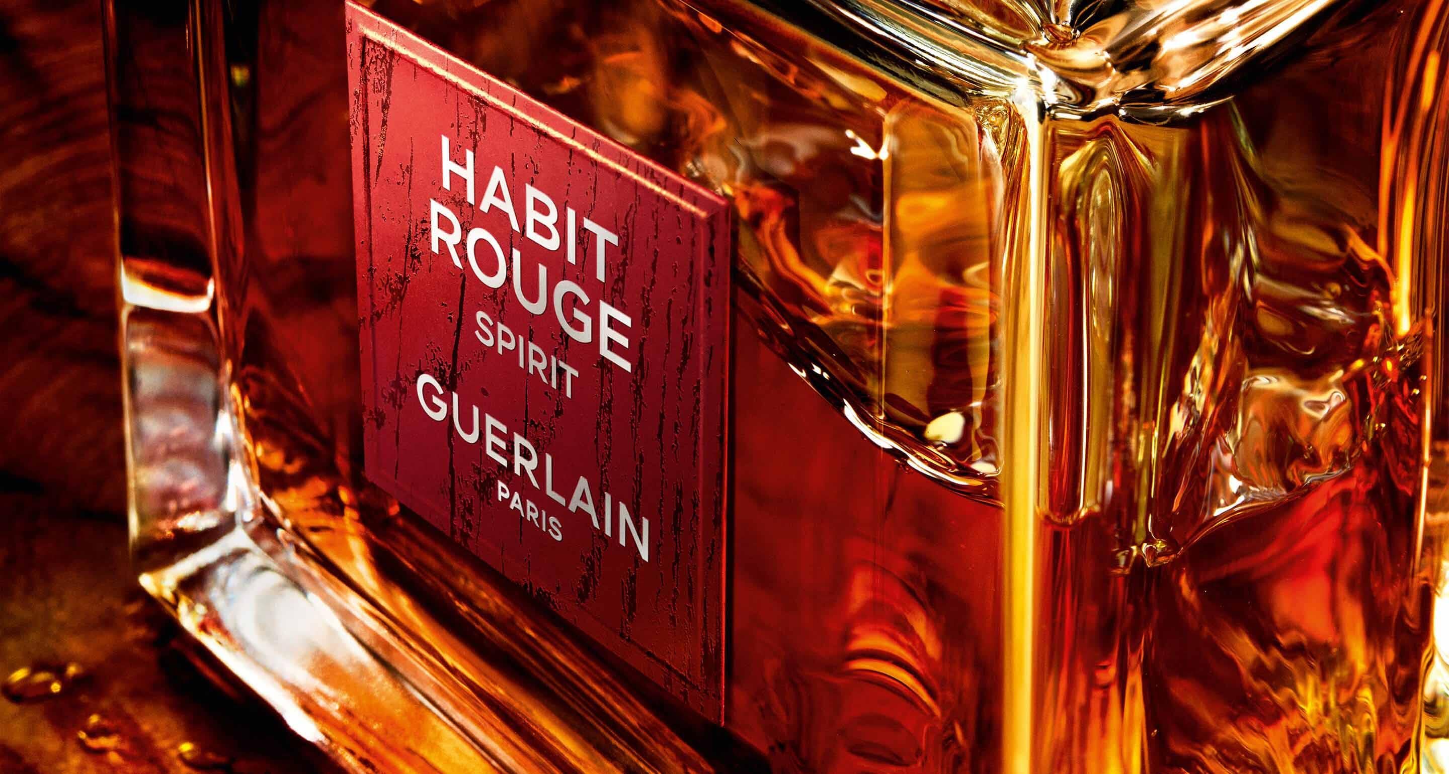 Close-up shot of a perfume bottle filled with warm amber liquid, highlighting its intricate details and luxurious design.