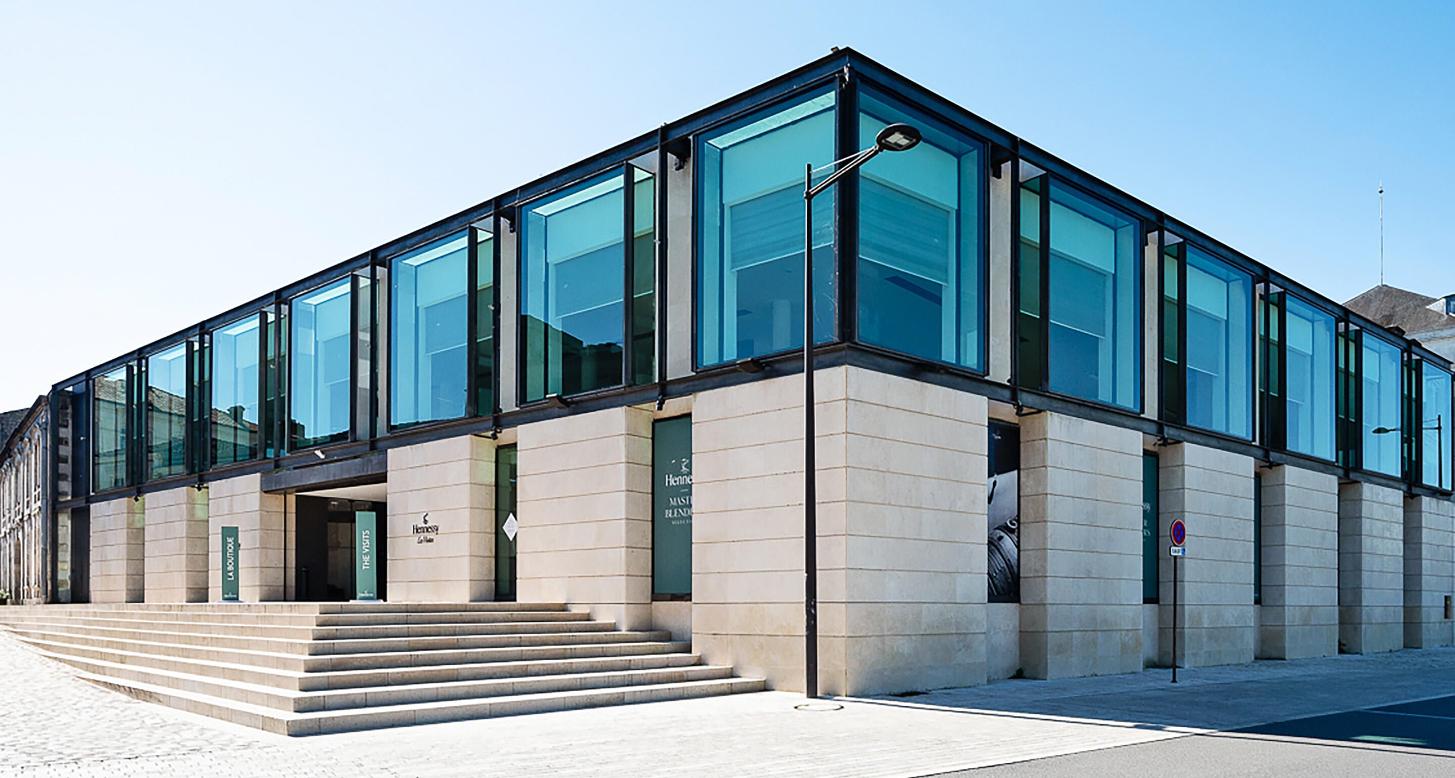 Exterior view of the Hennessy flagship store in Cognac, all glass and limestone, designed by famous French architect Jean-Michel Wuilmotte